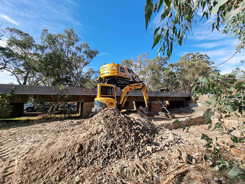Excavator performing site cuts in Central Victoria