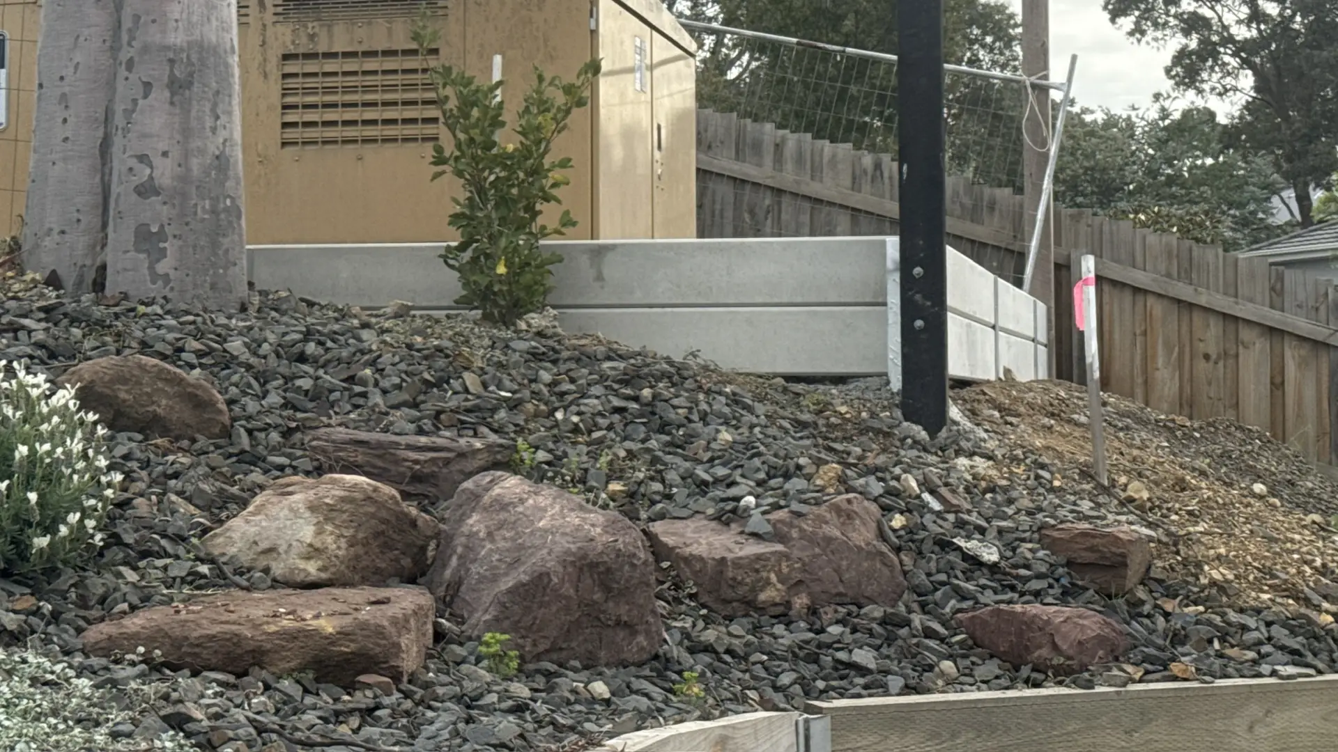 Retaining wall with Colorbond fence in Diamond Creek, VIC