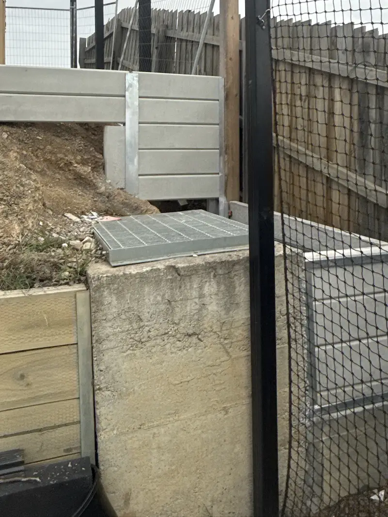 Retaining wall with Colorbond fence in Diamond Creek, VIC